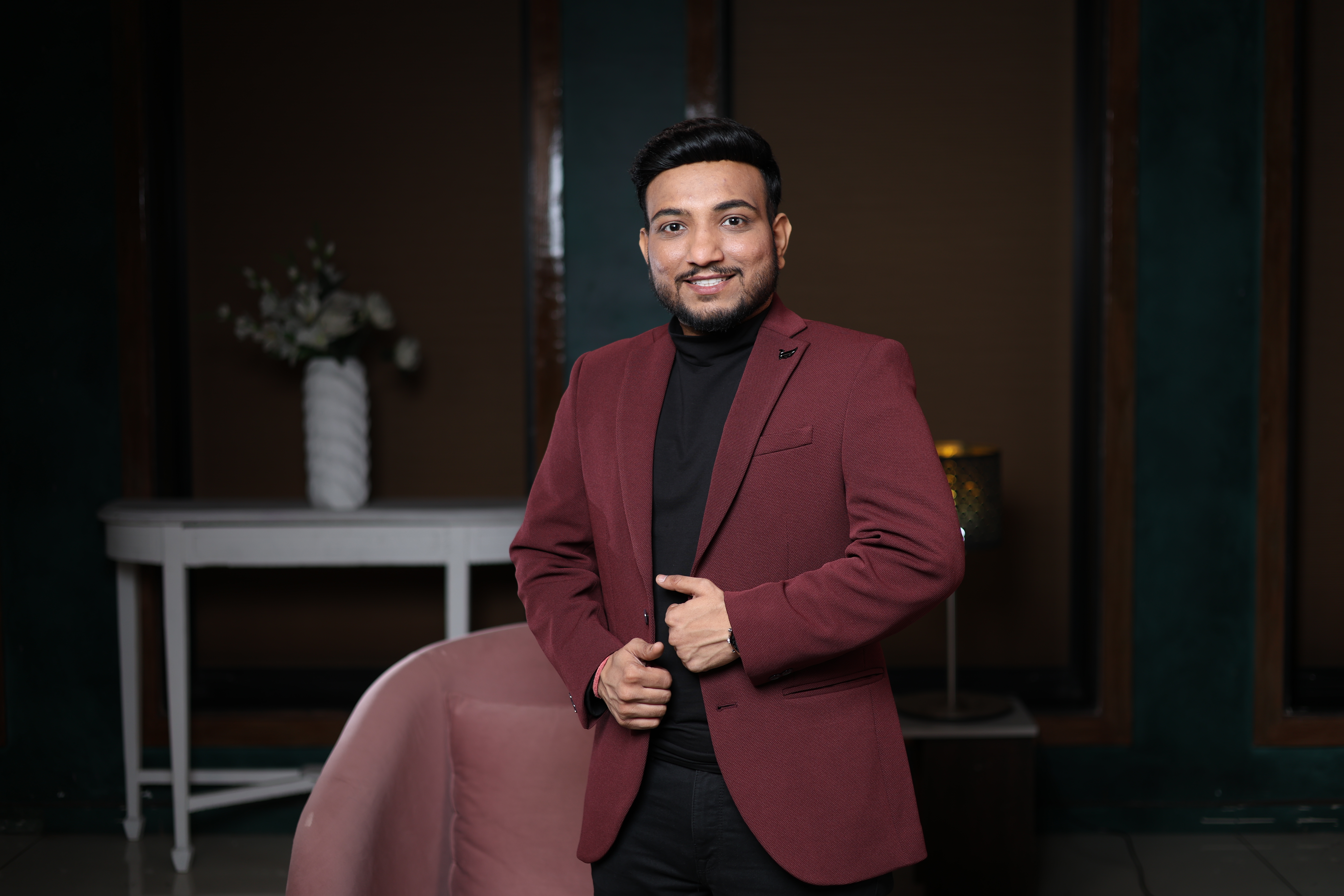 Sagar Shah standing in blazer — authority coaching pose